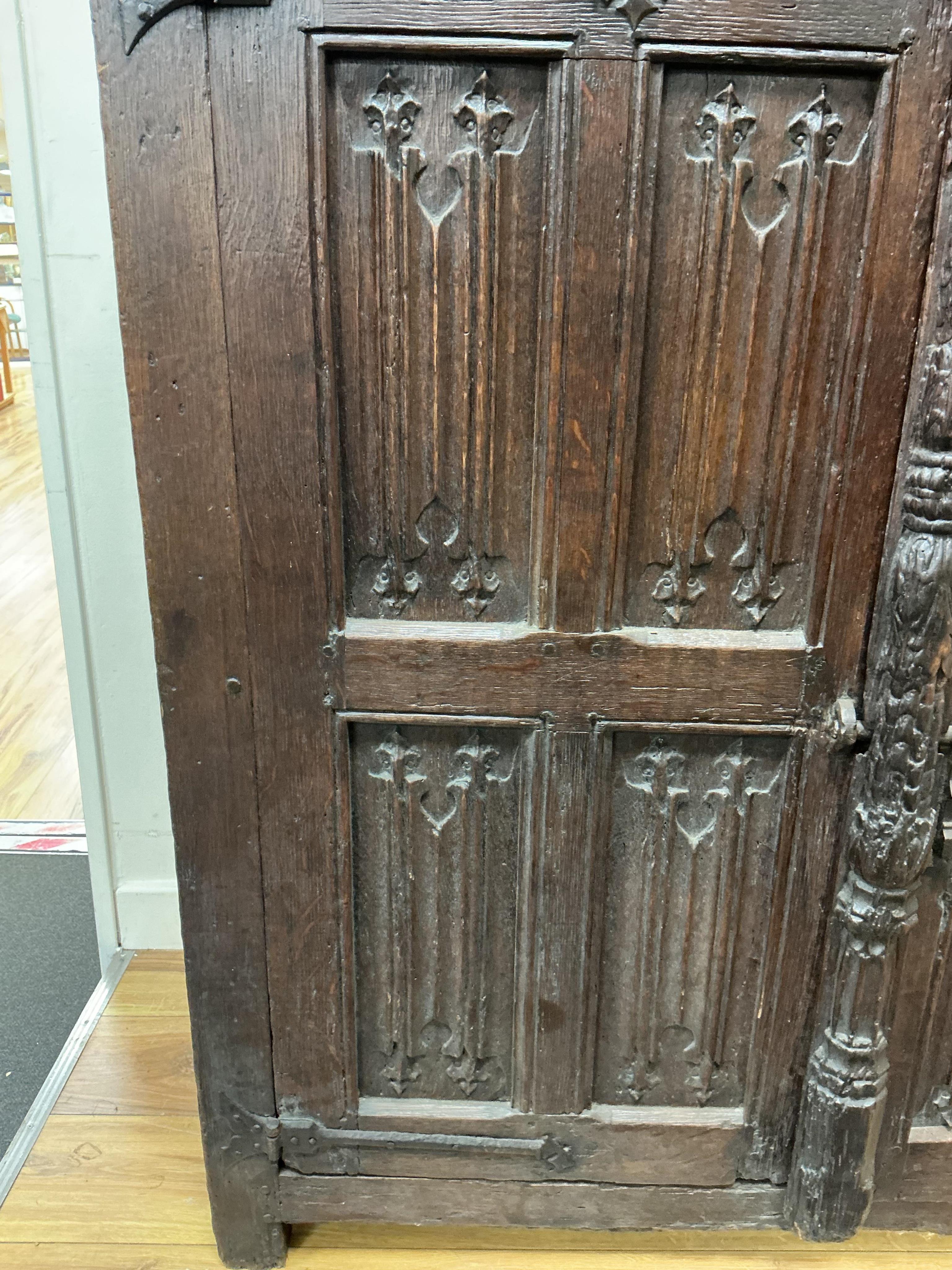 An 18th century and later French carved oak two door cabinet, width 115cm, depth 53cm, height 115cm